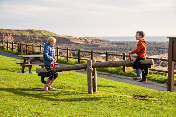 children on a see saw